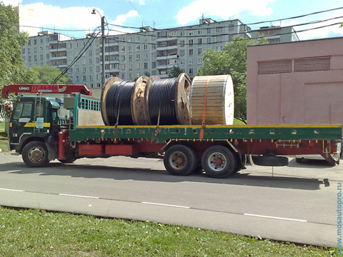 Перевозка кабеля в деревянных барабанах диаметром 2,2 и 1,8 метра манипулятором.